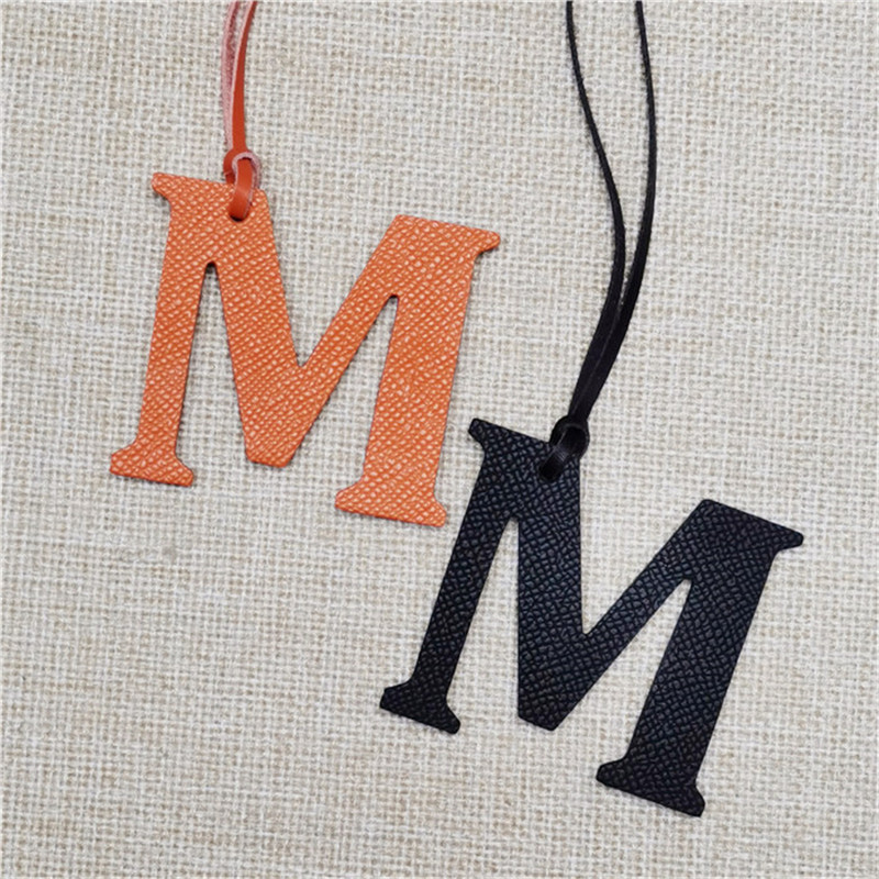 XMESSUN New English Letters M  - Monogram Keychain Leather 评论和价格